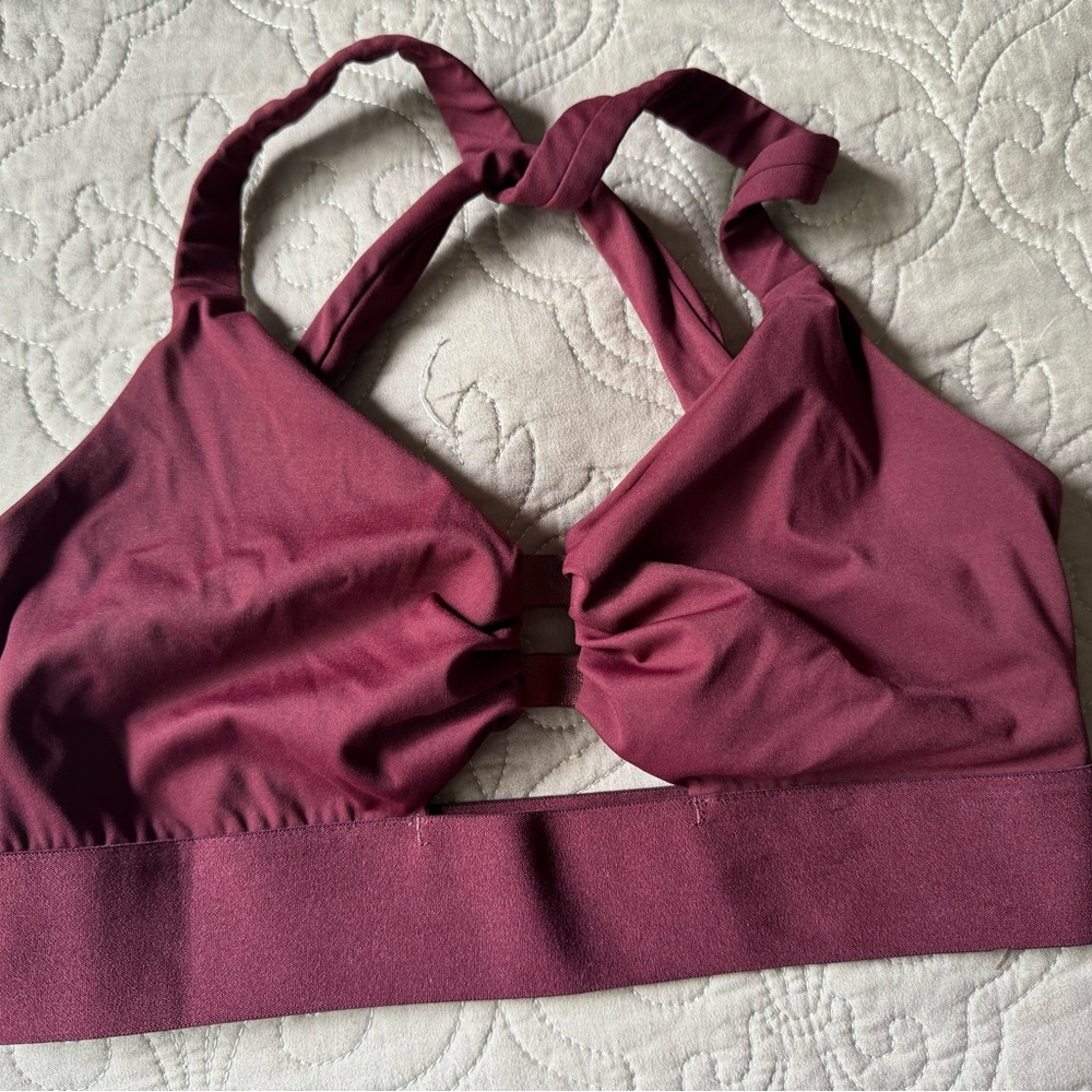 Born Primitive. Burgundy color.
